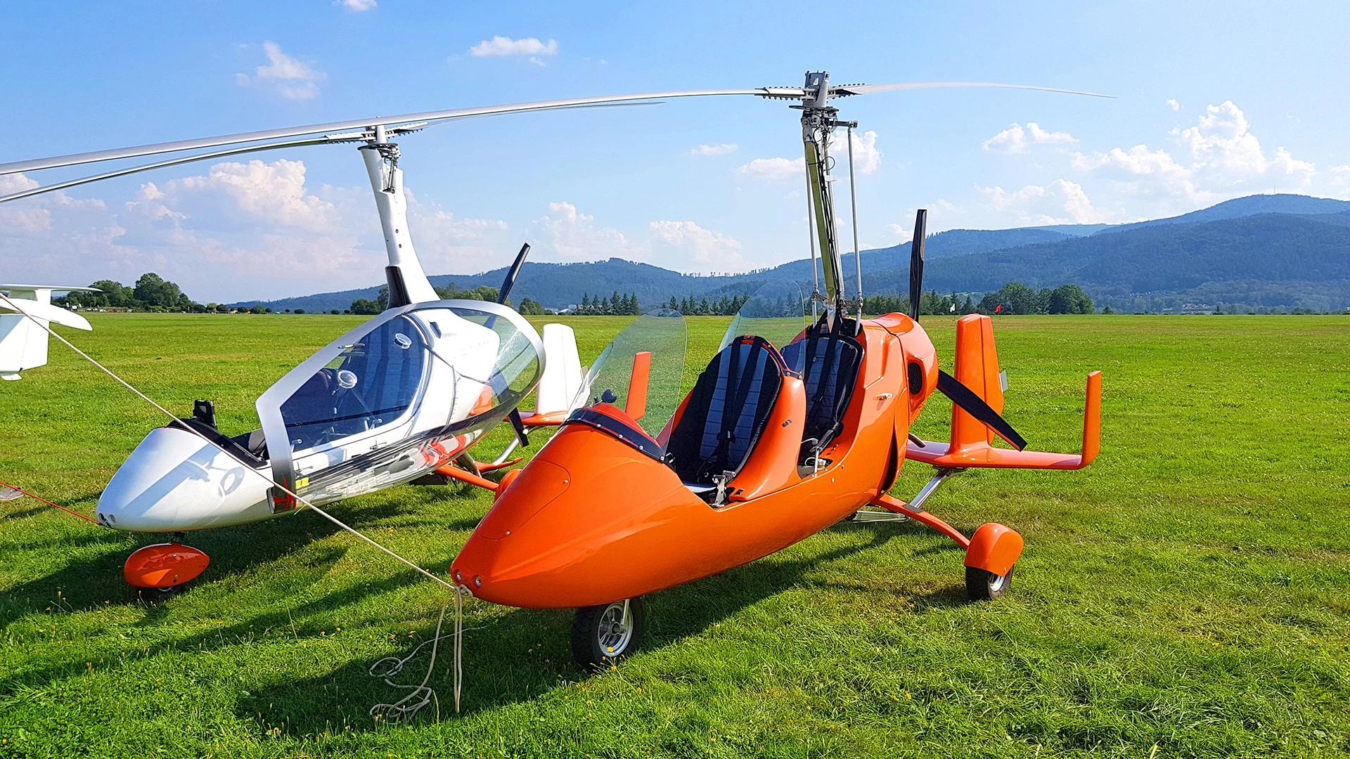 Gyrocopter Fly Over the Valley
