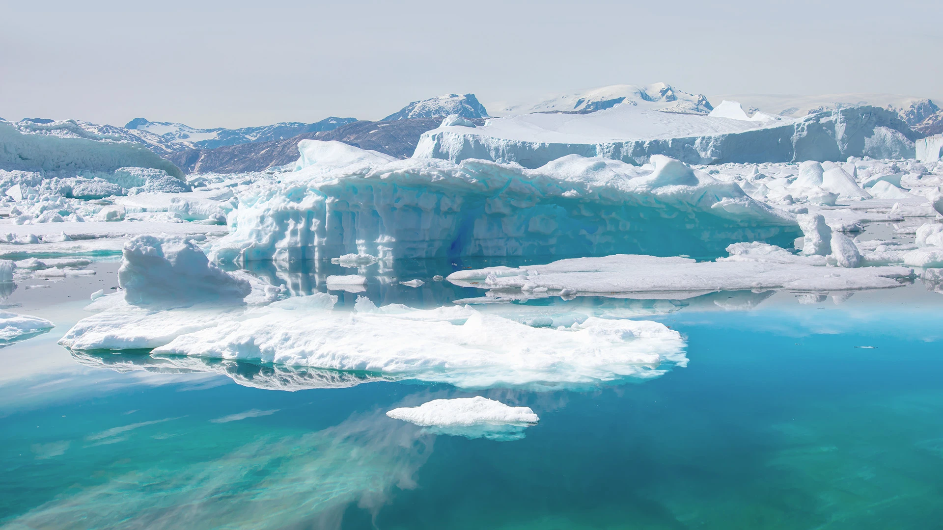 Iceberg into the sea Tiniteqilaaq Sermilik Fjord Greenland