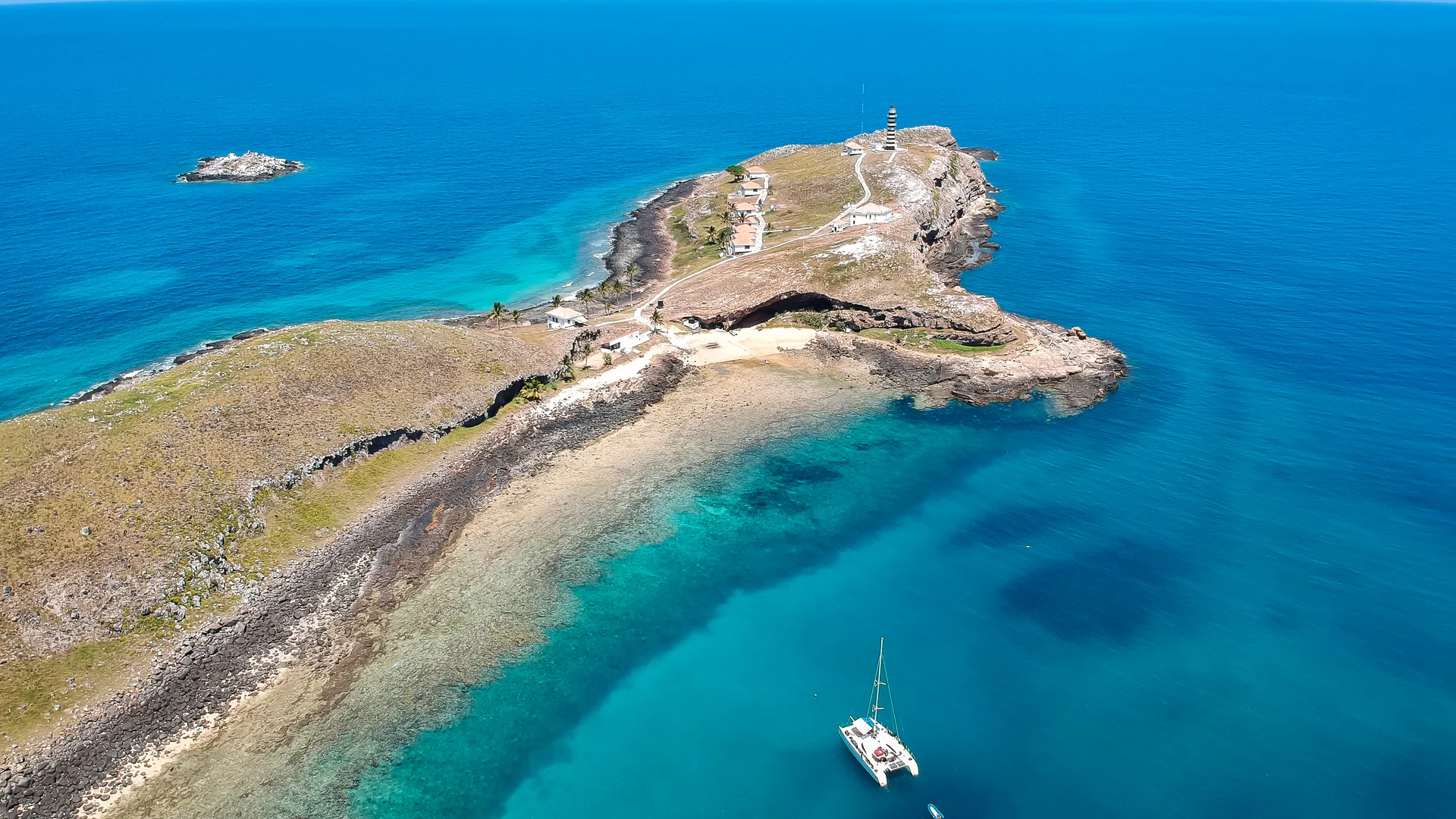 Low coral island in turquoise water, Abrolhos
