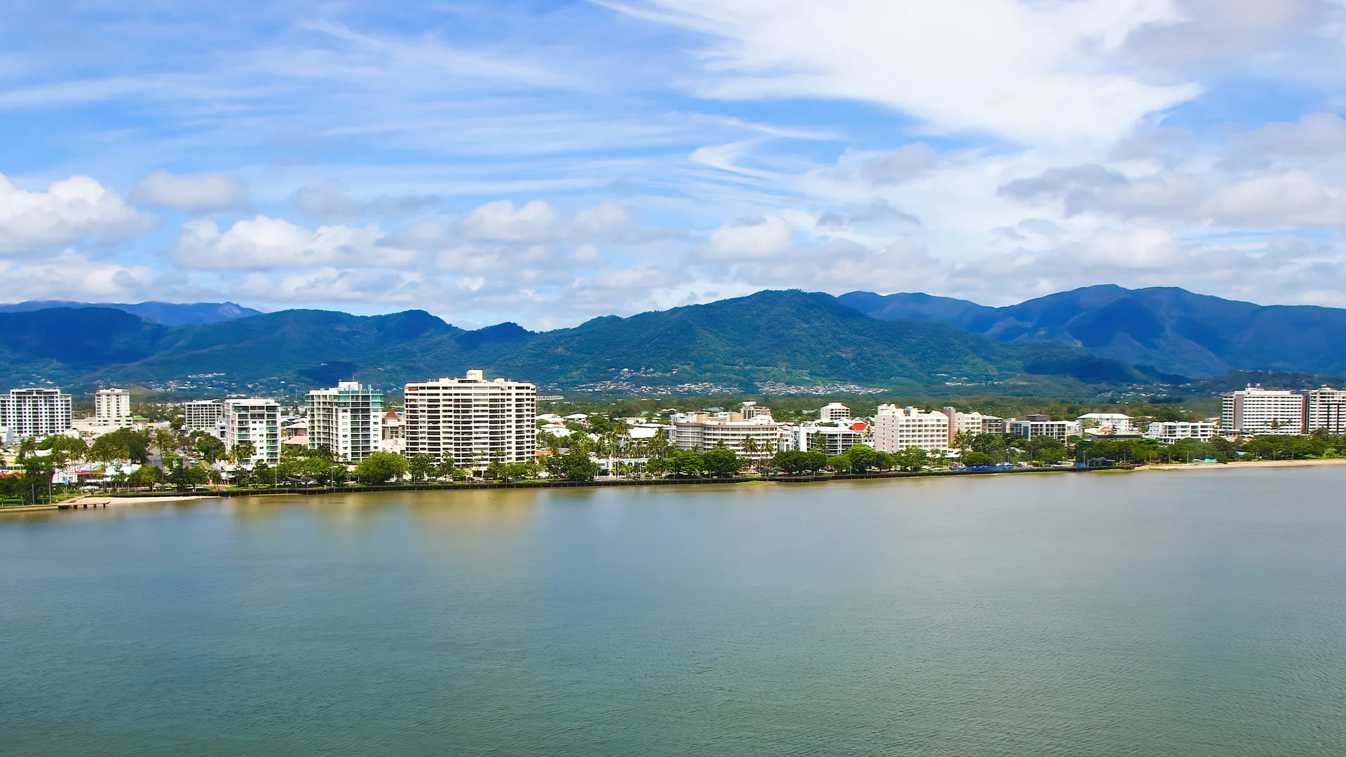 Cairns waterfront with mountain ranges behind