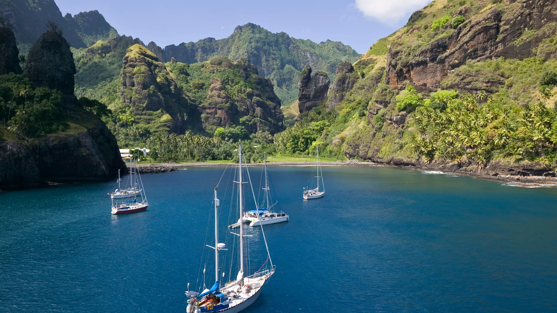 Lush green cliffs above the Bay of Virgins on Fatu Hiva