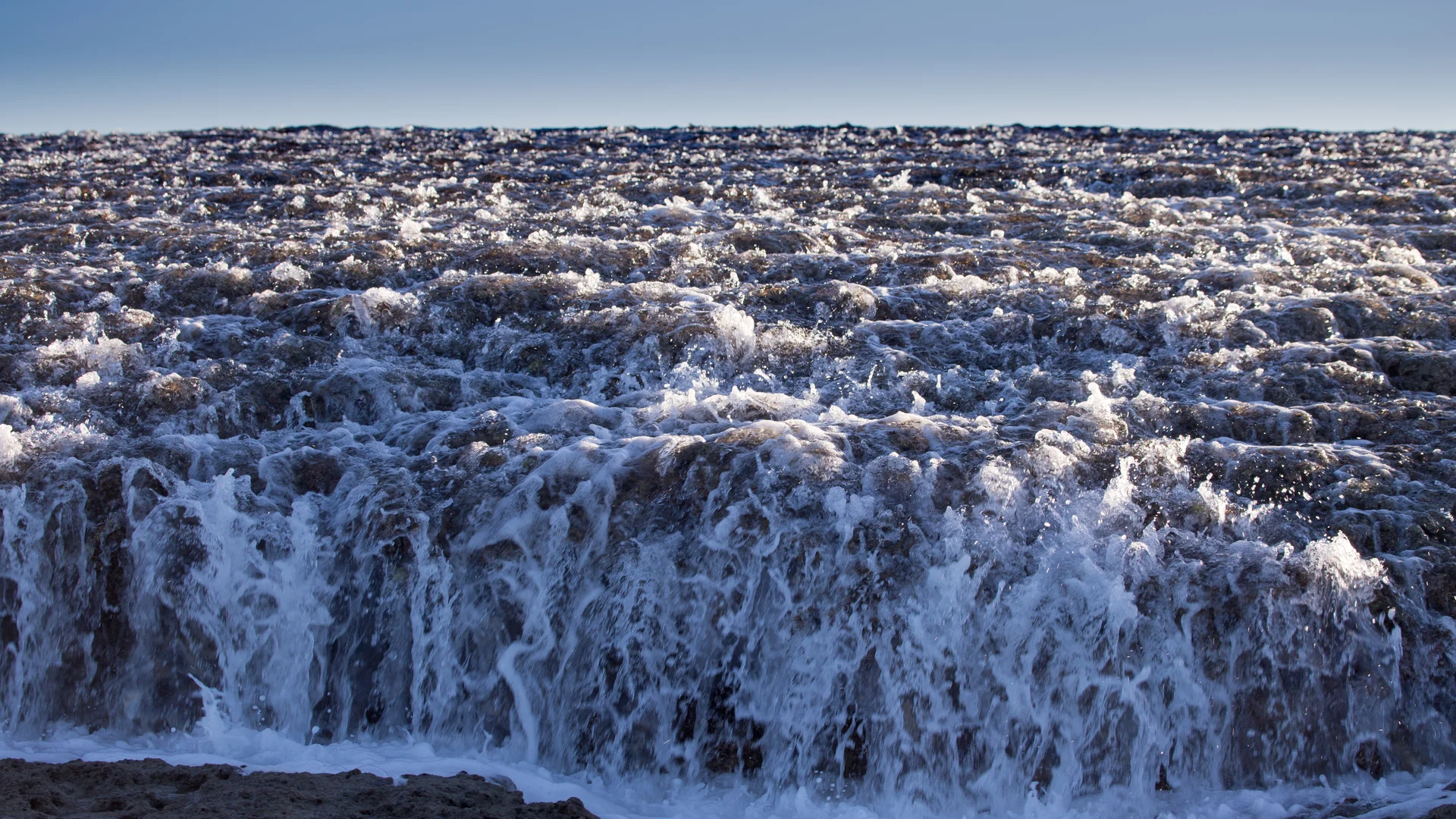 Water cascading off the reef as the tide drains