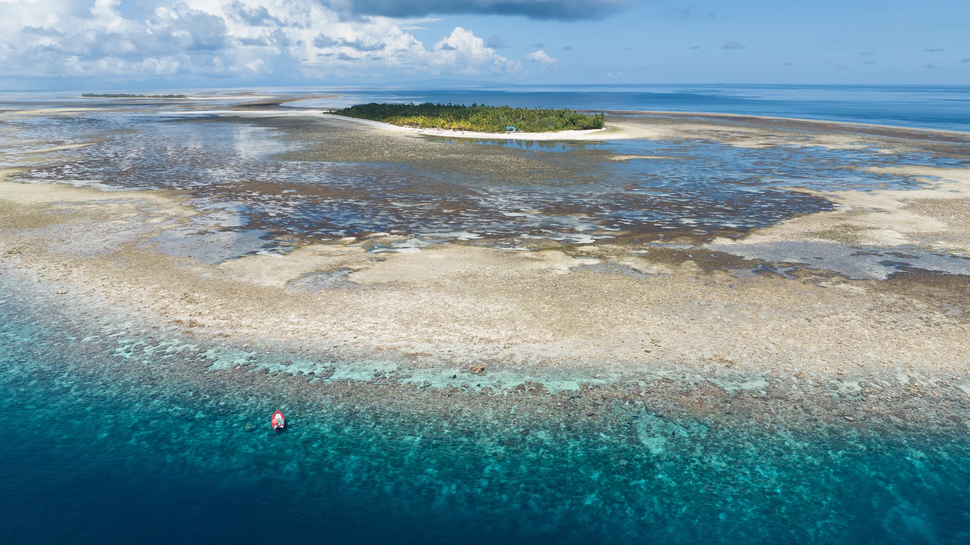 Coral reef and clear water fringing a PNG island