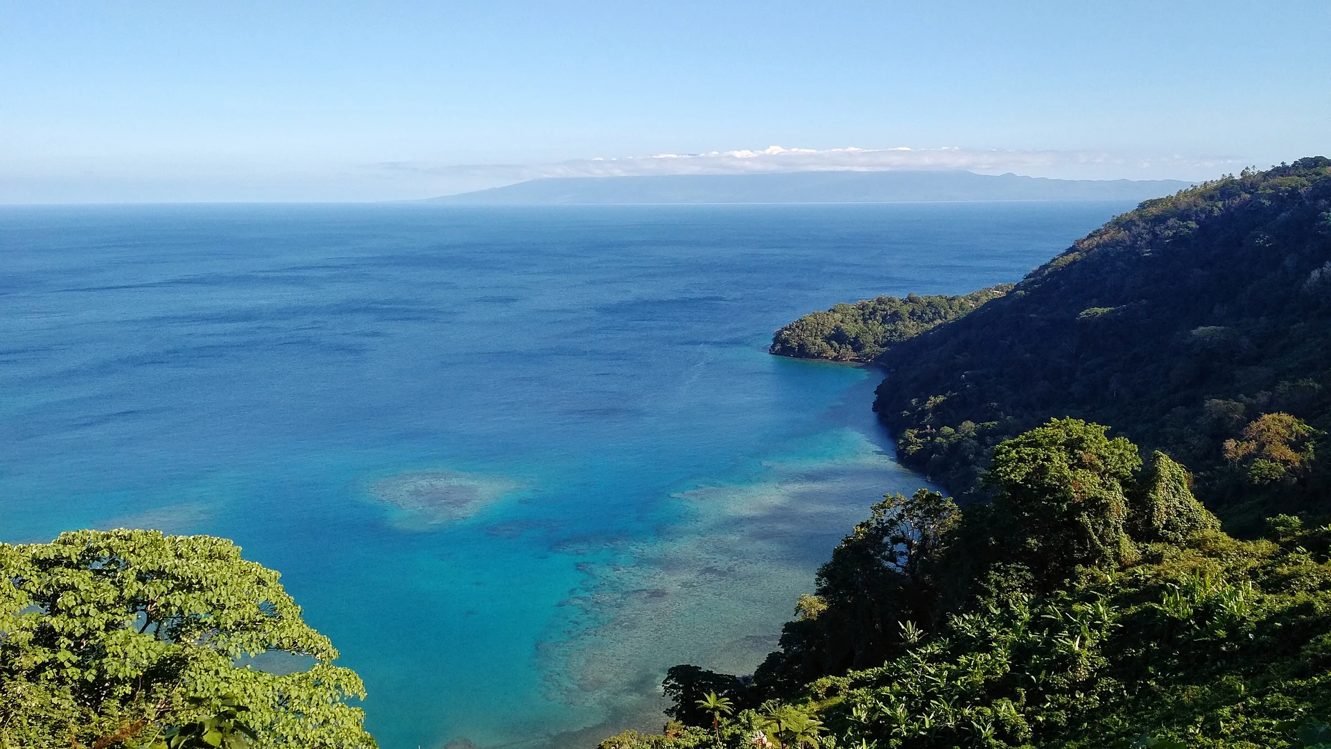 Turquoise bay and village, remote Vanuatu